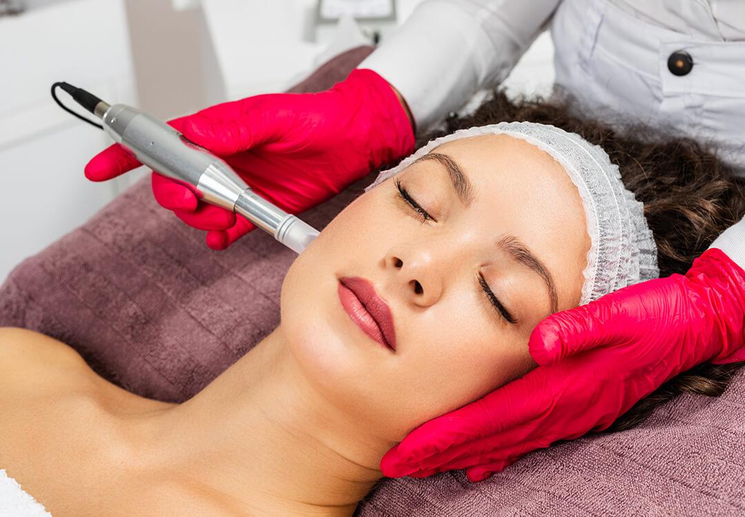 Close-up image of a woman getting a HydraFacial Desktop