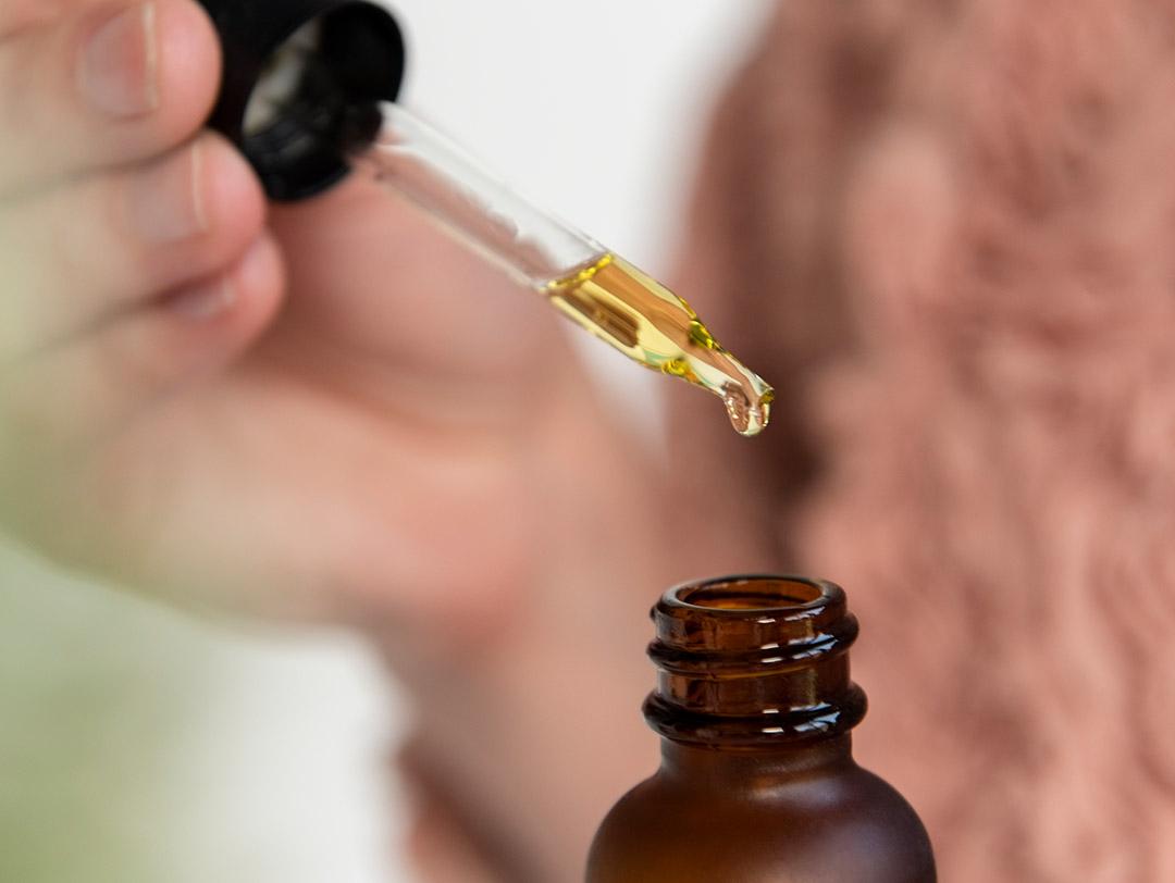 A closeup of a serum in a dropper Desktop