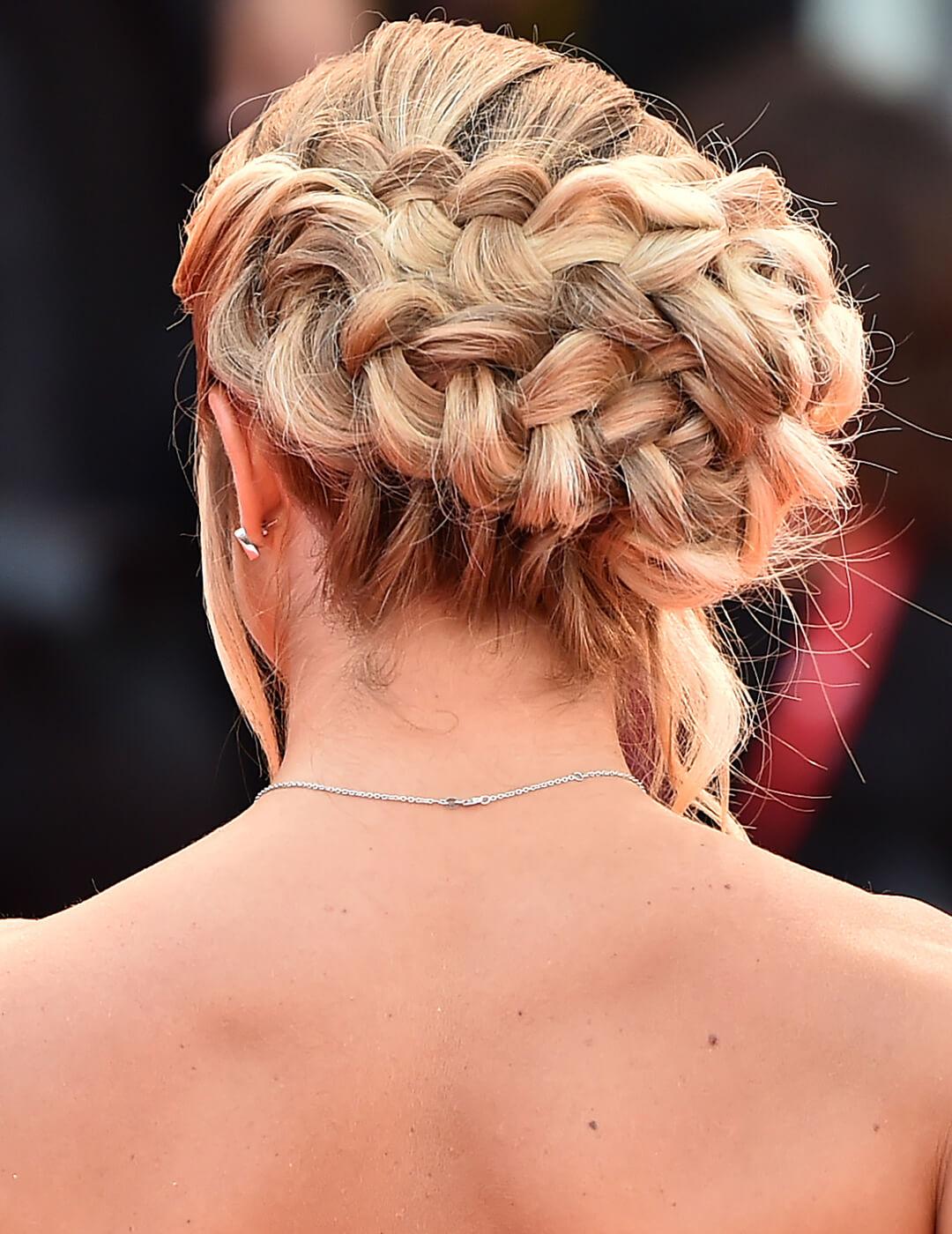 Anna Penello facing back showing off her braided updo hairstyle Mobile