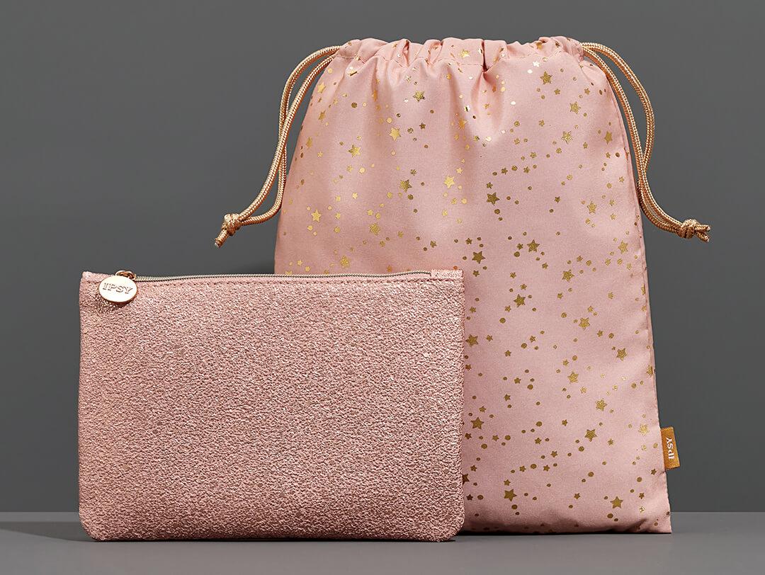 December 2021 IPSY Glam Bag and Glam Bag Plus bags on dark grey background Desktop