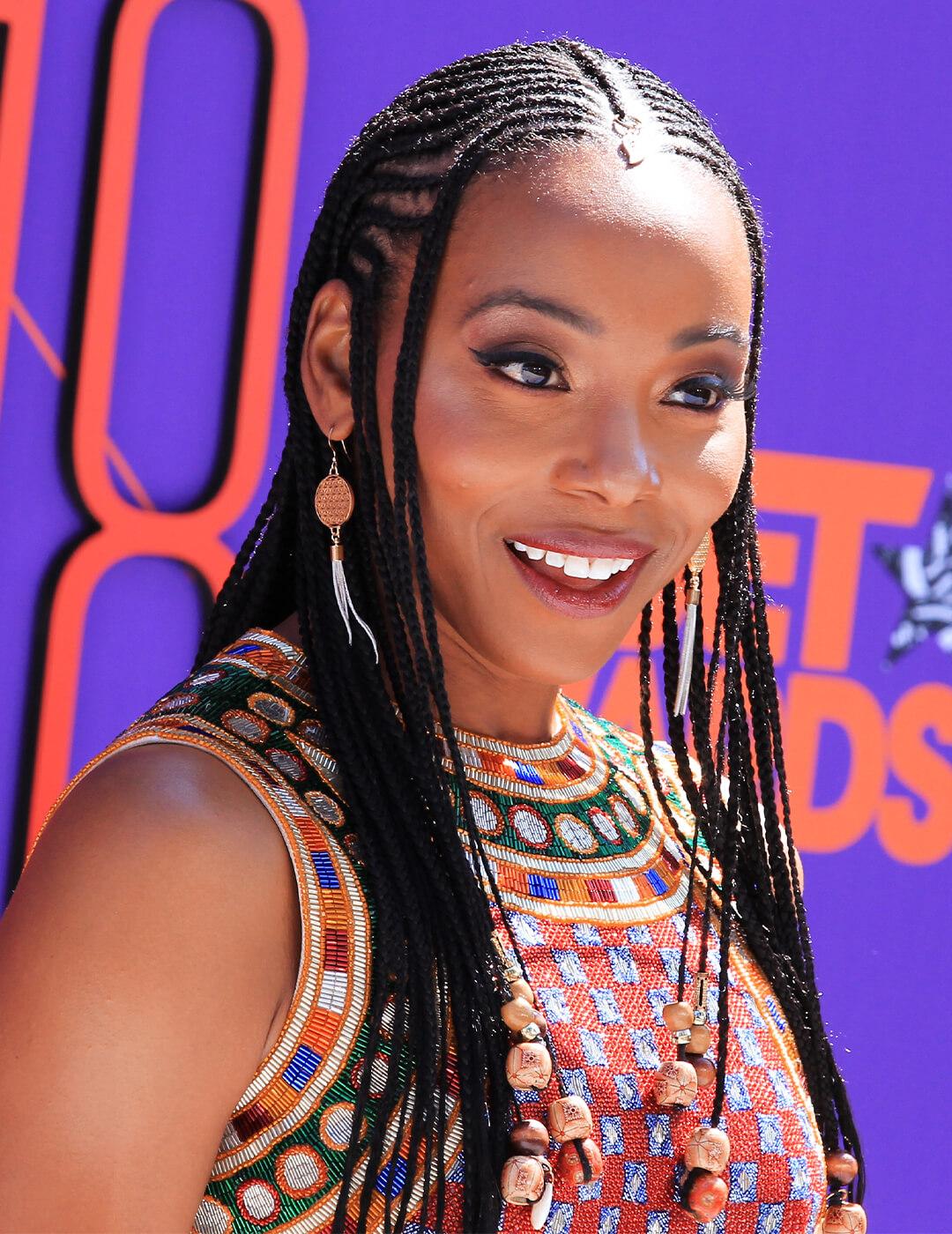 Erica Ash in a tribal patterned outfit rocking her braided hairstyle Desktop