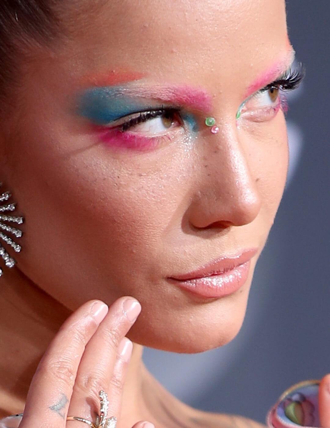 Close-up of Halsey rocking a neon pink and blue eyeshadow look Desktop