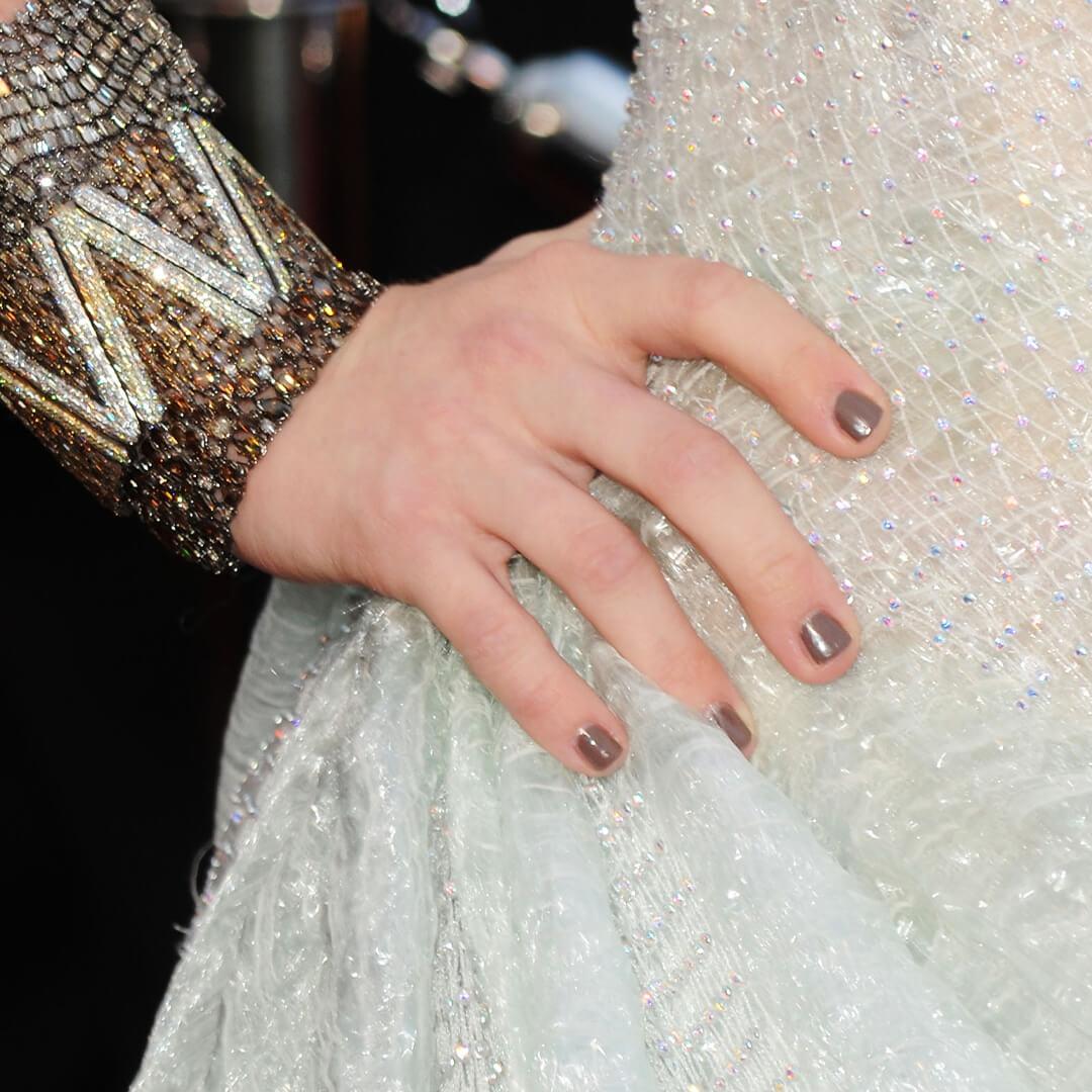 Close-up of Amanda Seyfried's grey nails on her white sequined dress Mobile