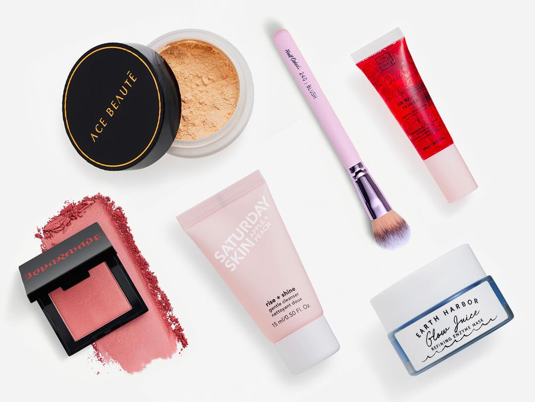 Makeup and skincare products and tools from the October 2023 IPSY Glam Bag on white background Desktop