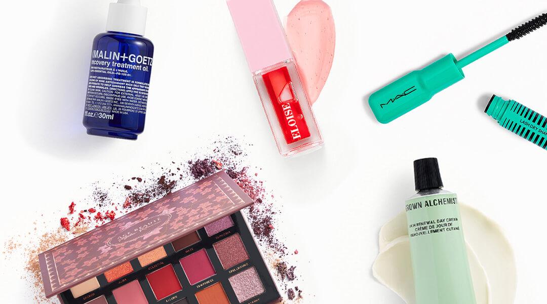 Skincare and makeup products from various brands on white background Desktop