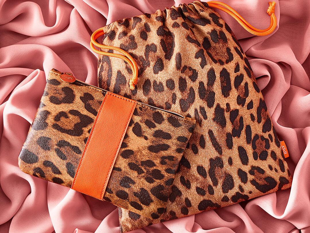 November 2022 IPSY Glam Bag and Glam Bag Plus bags on rose pink velvet cloth Desktop