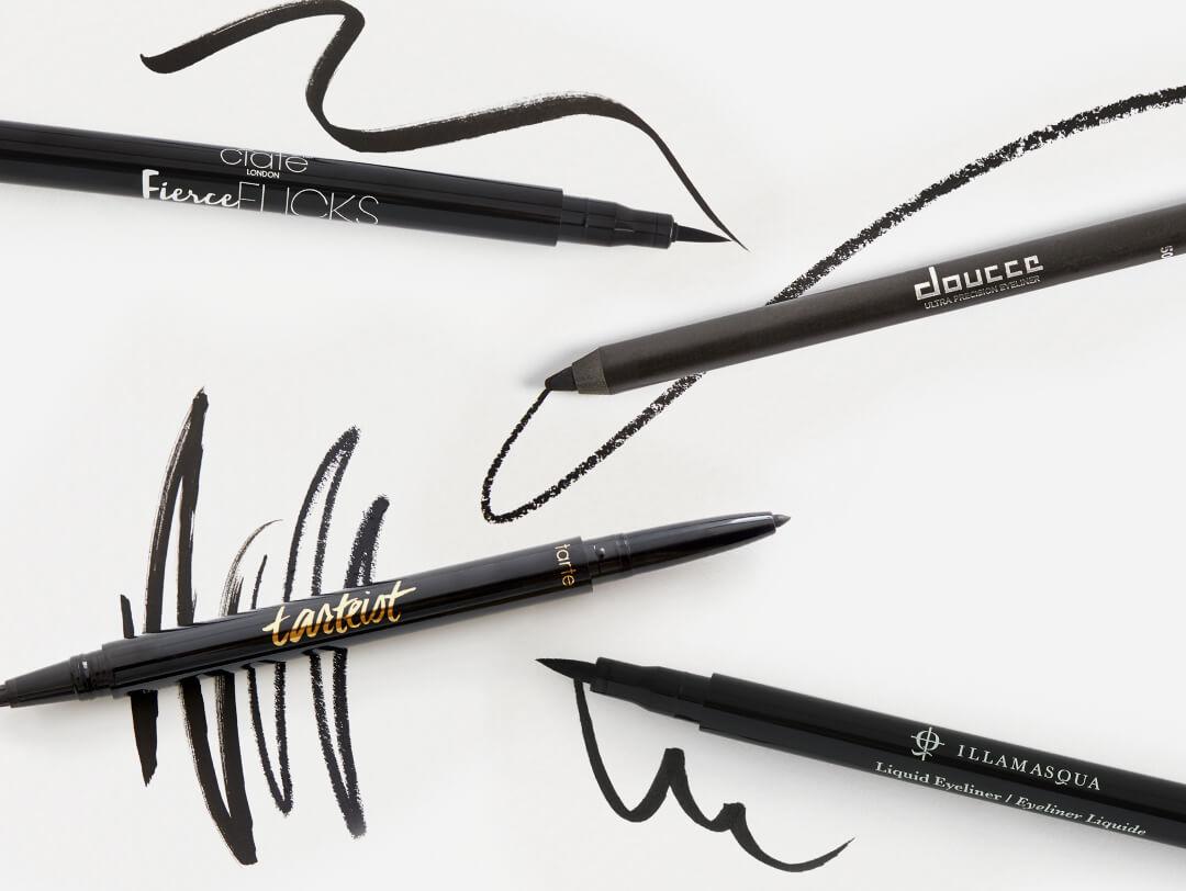 Four smudge proof eyeliners from various brands swatched on white background Desktop