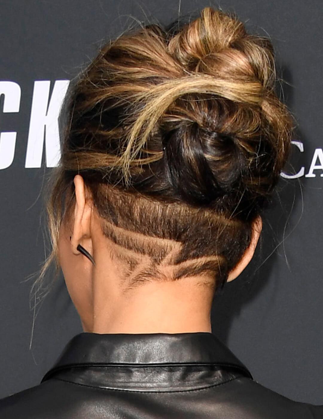 Back view of Halle Berry's updo undercut hairstyle with intricate details Mobile