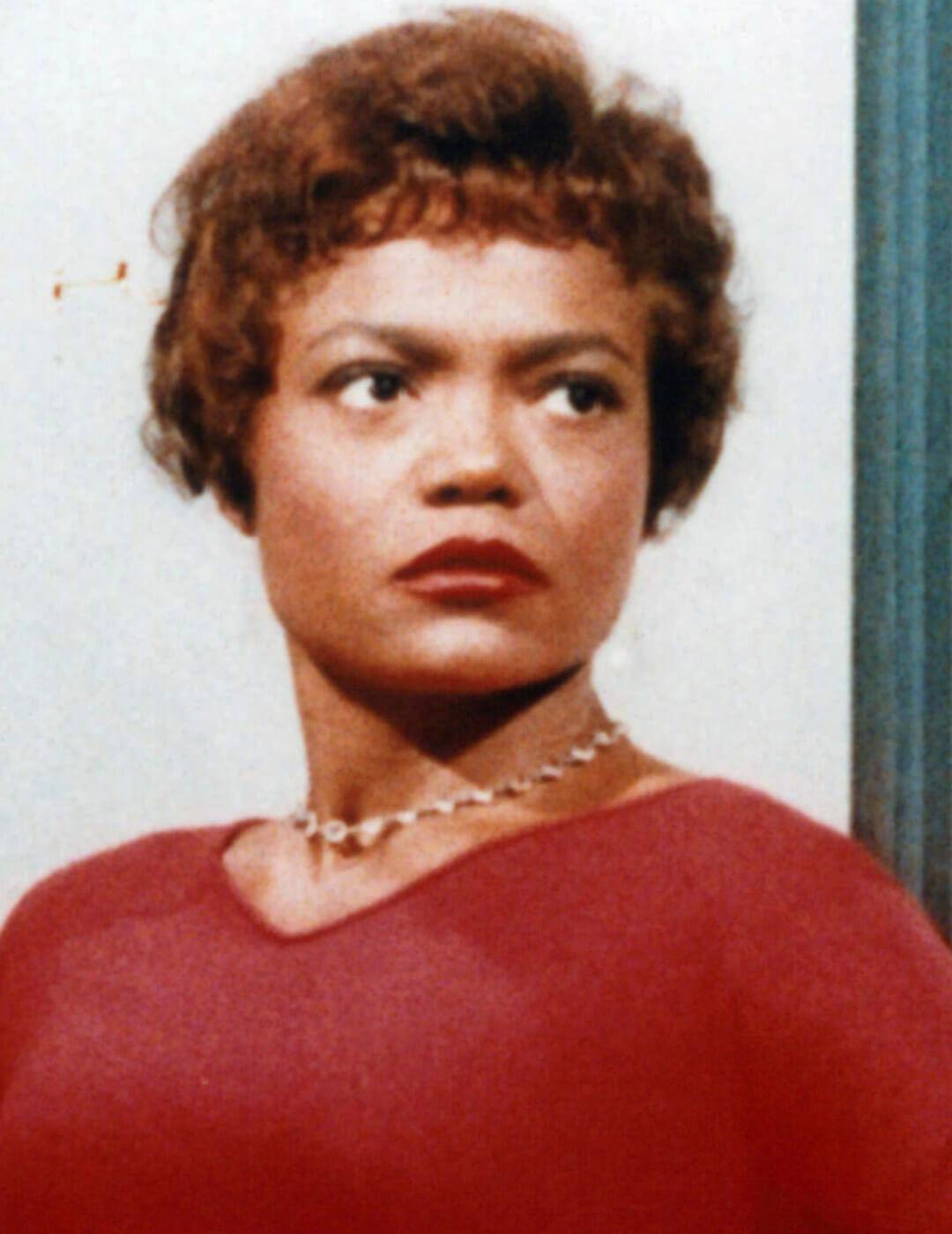 Old portrait of Eartha Kitt in a red dress and gold neclace Desktop