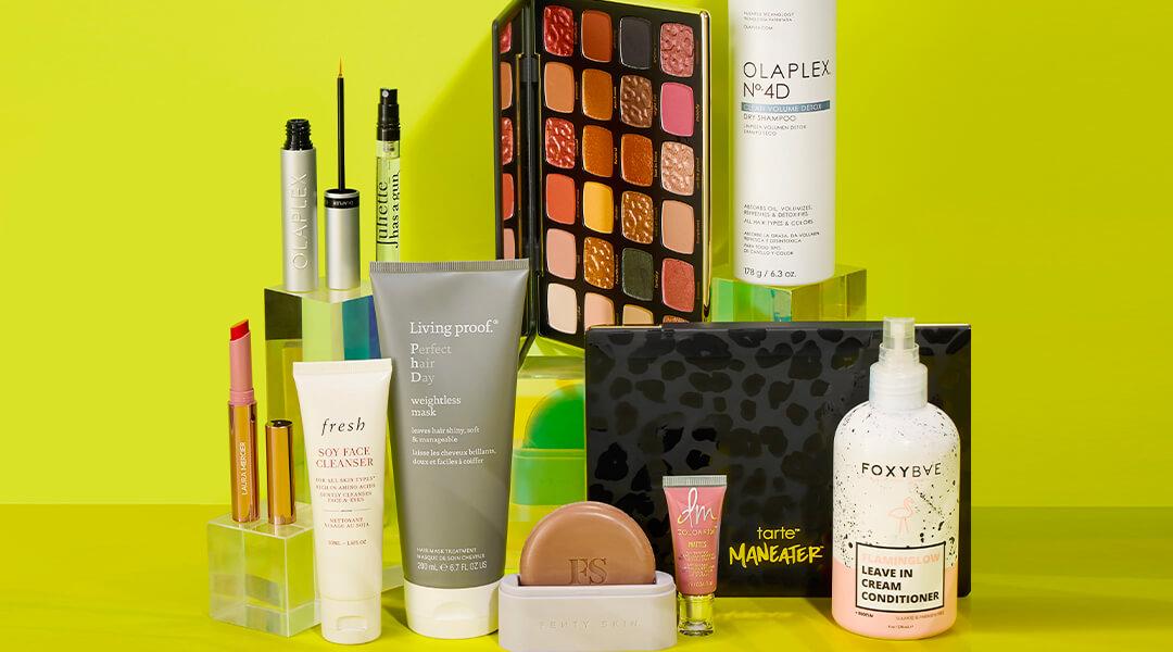 Skincare and makeup products from various brands on a green background Desktop