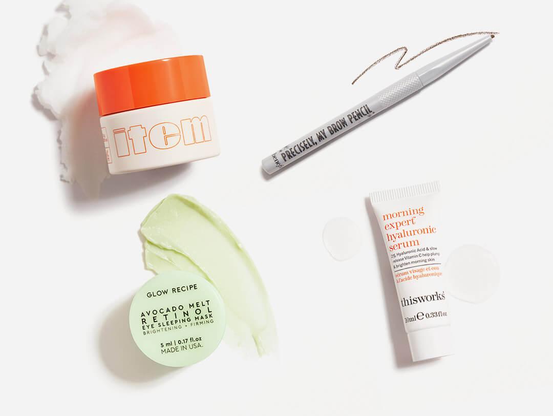 Makeup, hair care, and skincare products from the August 2021 IPSY Glam Bag swatched on white background Desktop