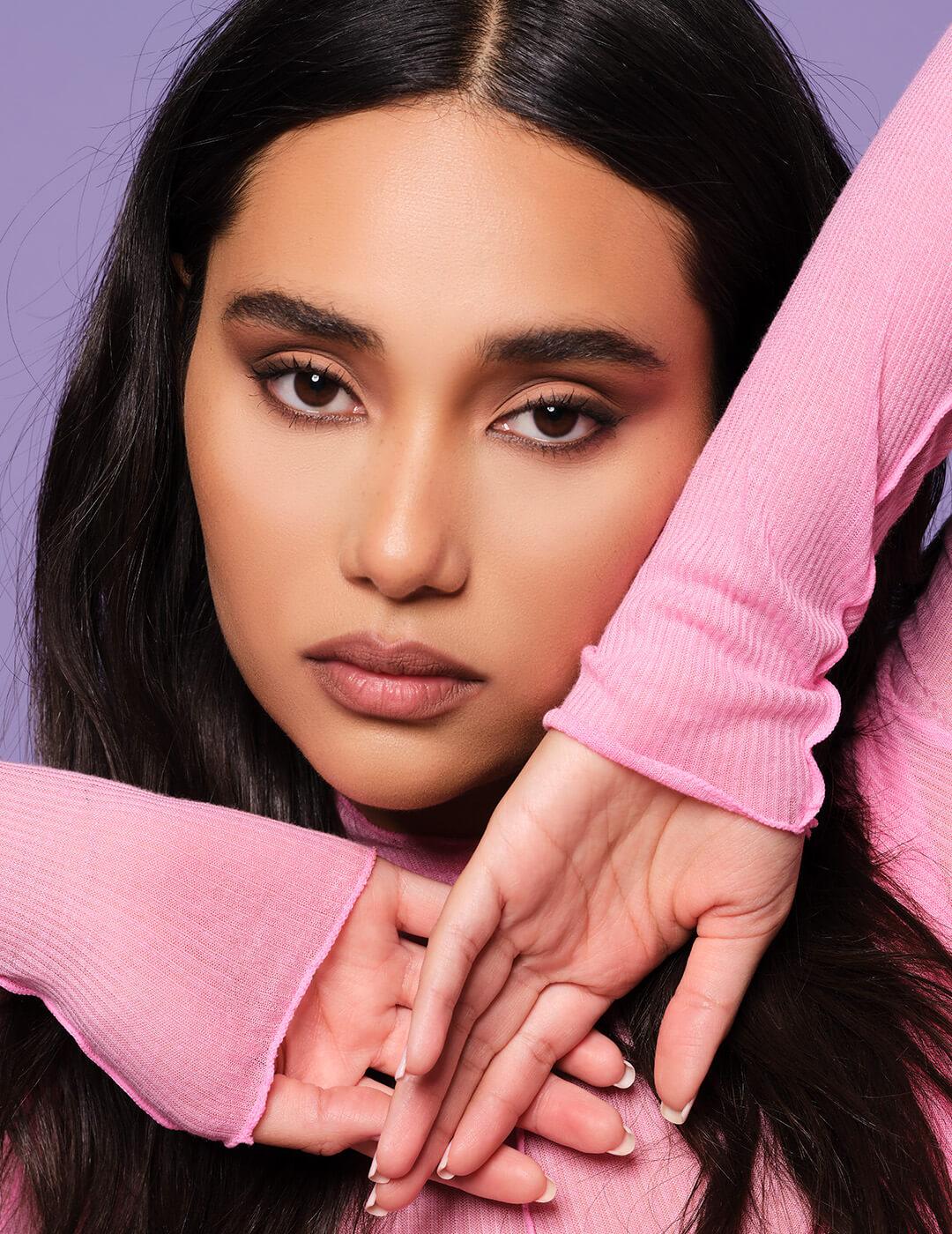 Model posing and wearing Ash K Holm's signature sultry eye makeup look Desktop