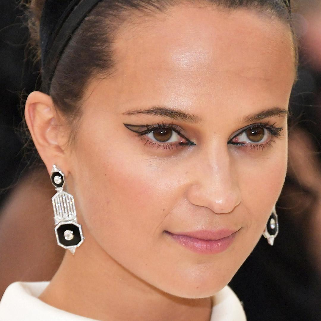 A photo of Alicia Vikander with a graphic eyeliner outline Desktop