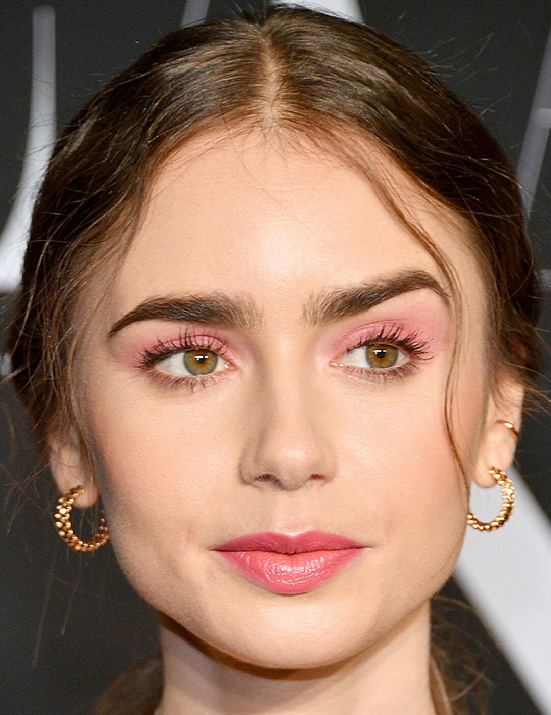 Lily Collins with a pink eyeshadow makeup look paired with nude lips Desktop