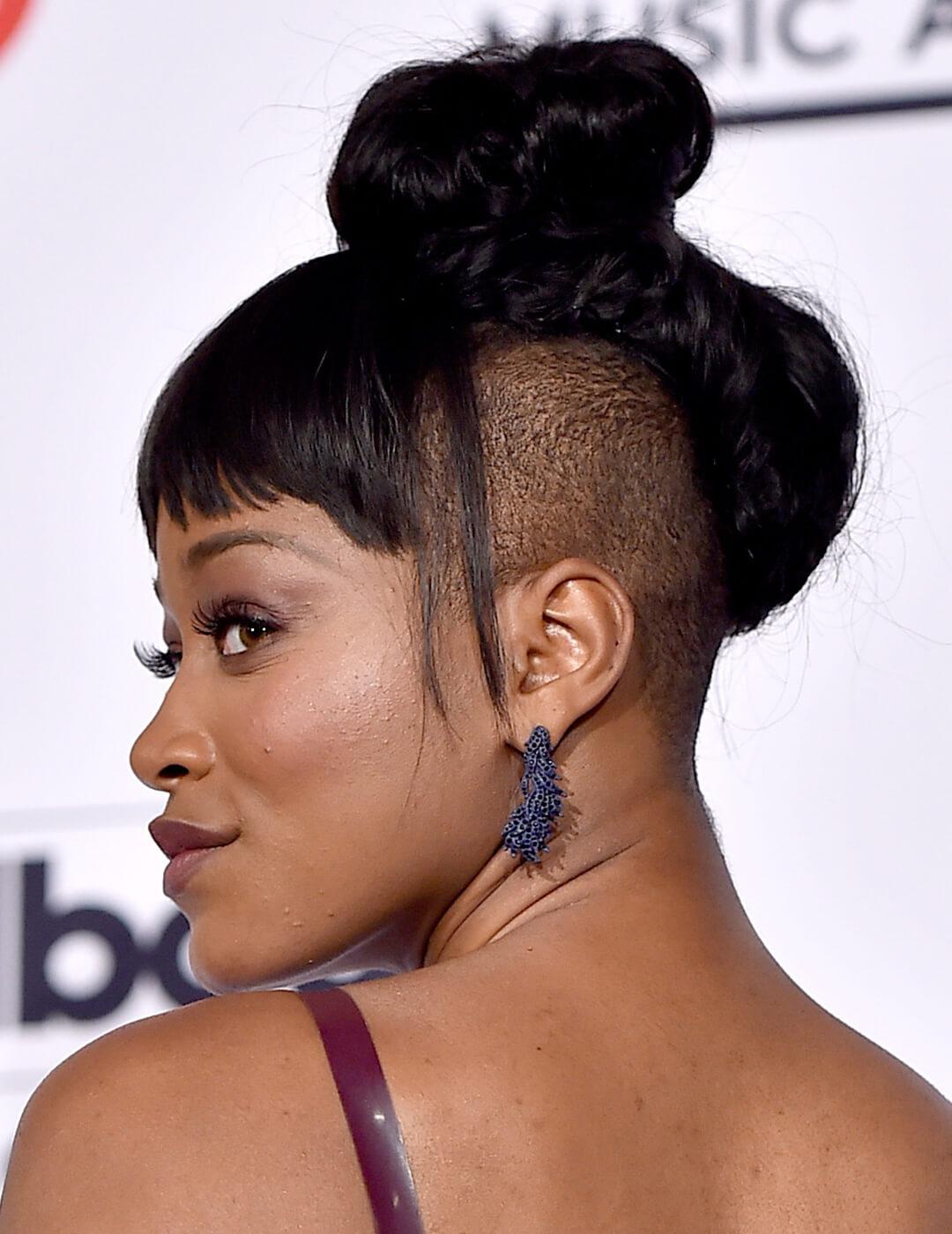 Keke Palmer showing off her top knot undercut hairstyle with bangs Mobile