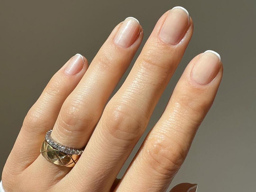 Close-up of a woman's micro French manicure Desktop