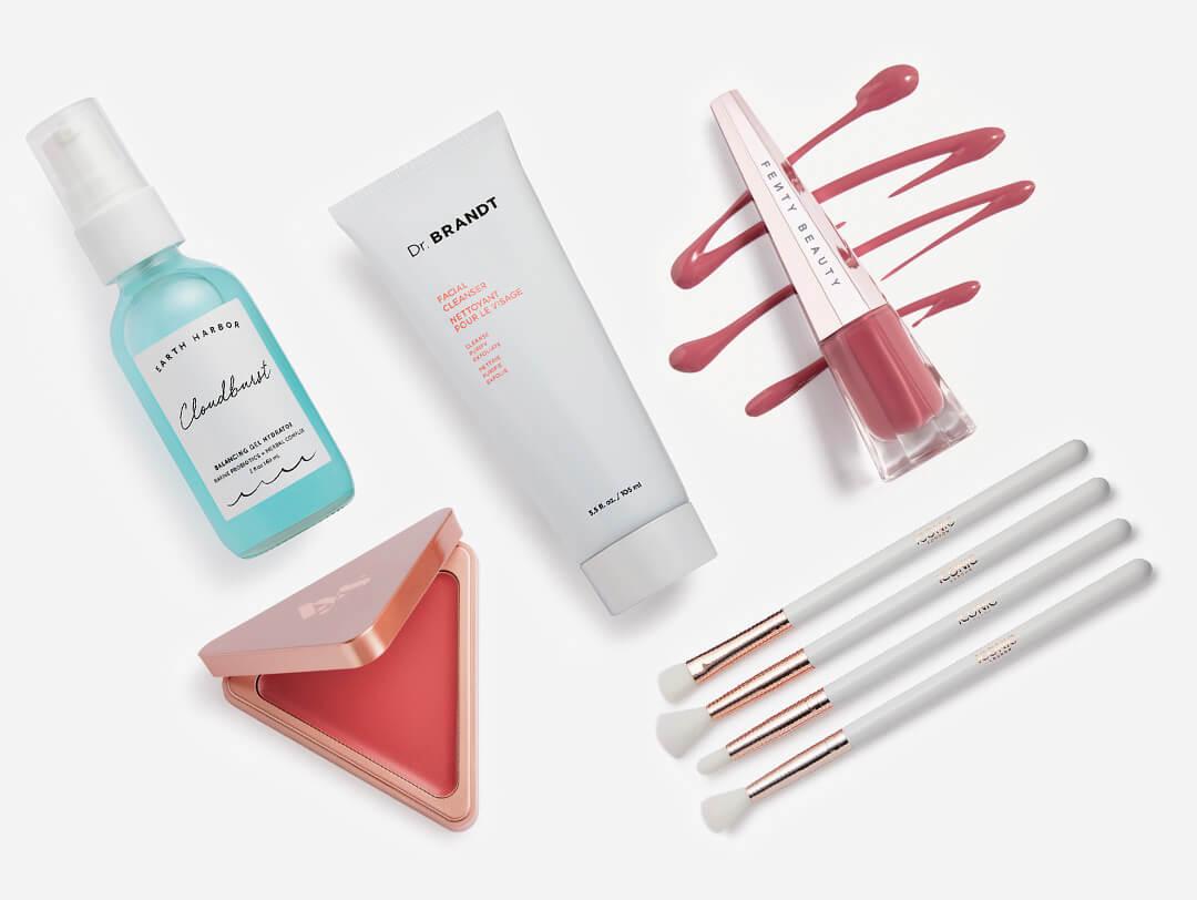 Makeup and skincare products and tools from the October 2022 IPSY Glam Bag Plus on white background Desktop
