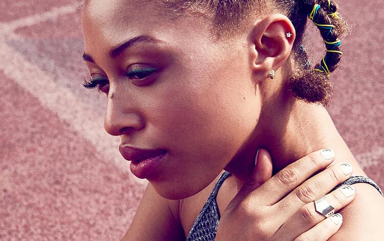 Jaleesa Moses rubs her neck after working out. Desktop