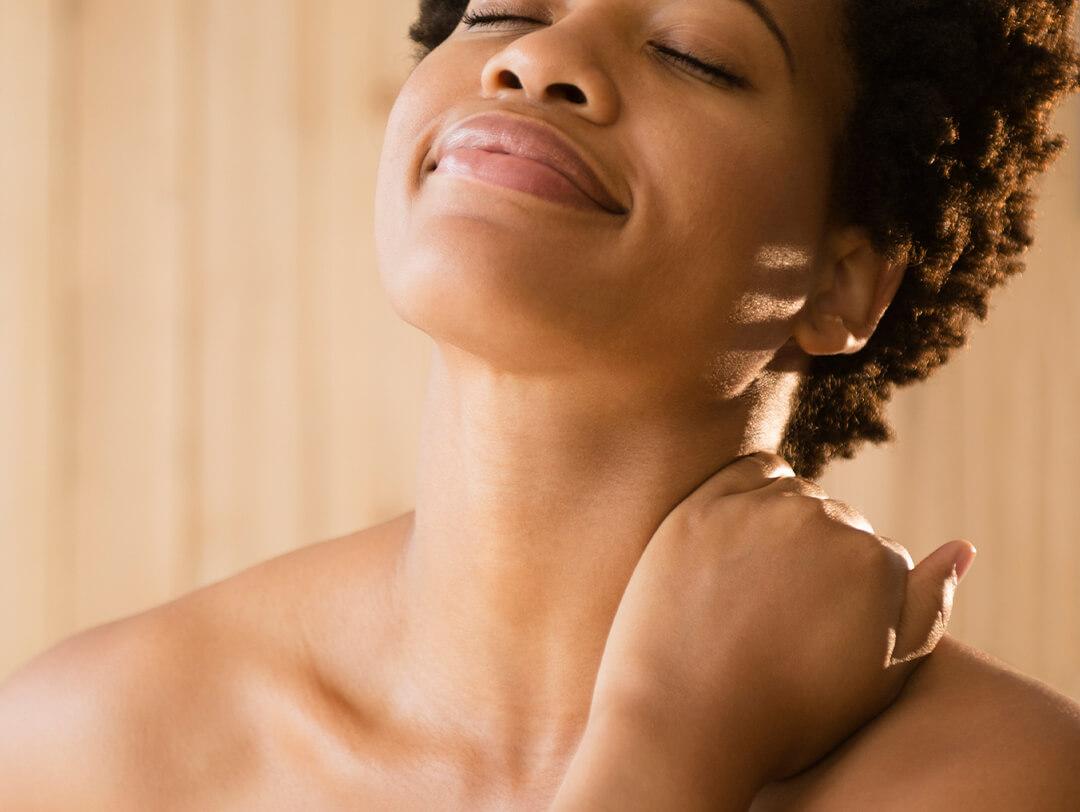 Close-up of a black woman touching her neck Desktop