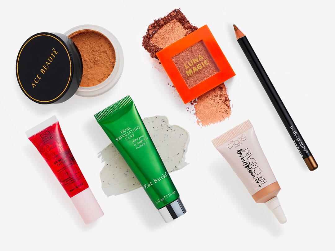 Makeup and skincare beauty products from the October 2023 IPSY Glam Bag on white background Desktop