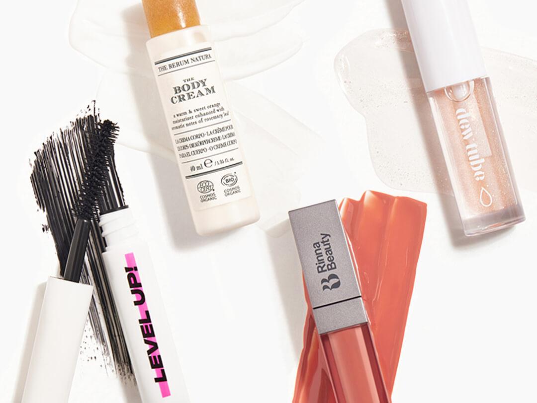 Makeup and skincare products from the October 2021 IPSY Glam Bag swatched on white background Desktop