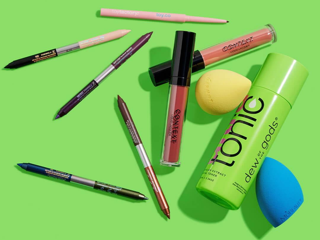 Makeup and skincare products and tools from various brands on lime green background Desktop