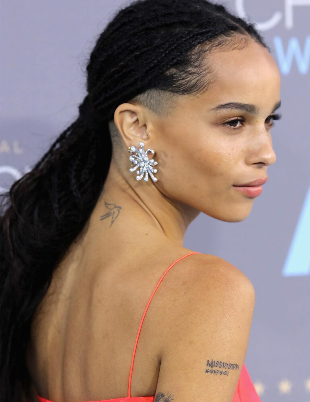 A photo of Zoe Kravitz with braids with half-shave hairstyle Mobile