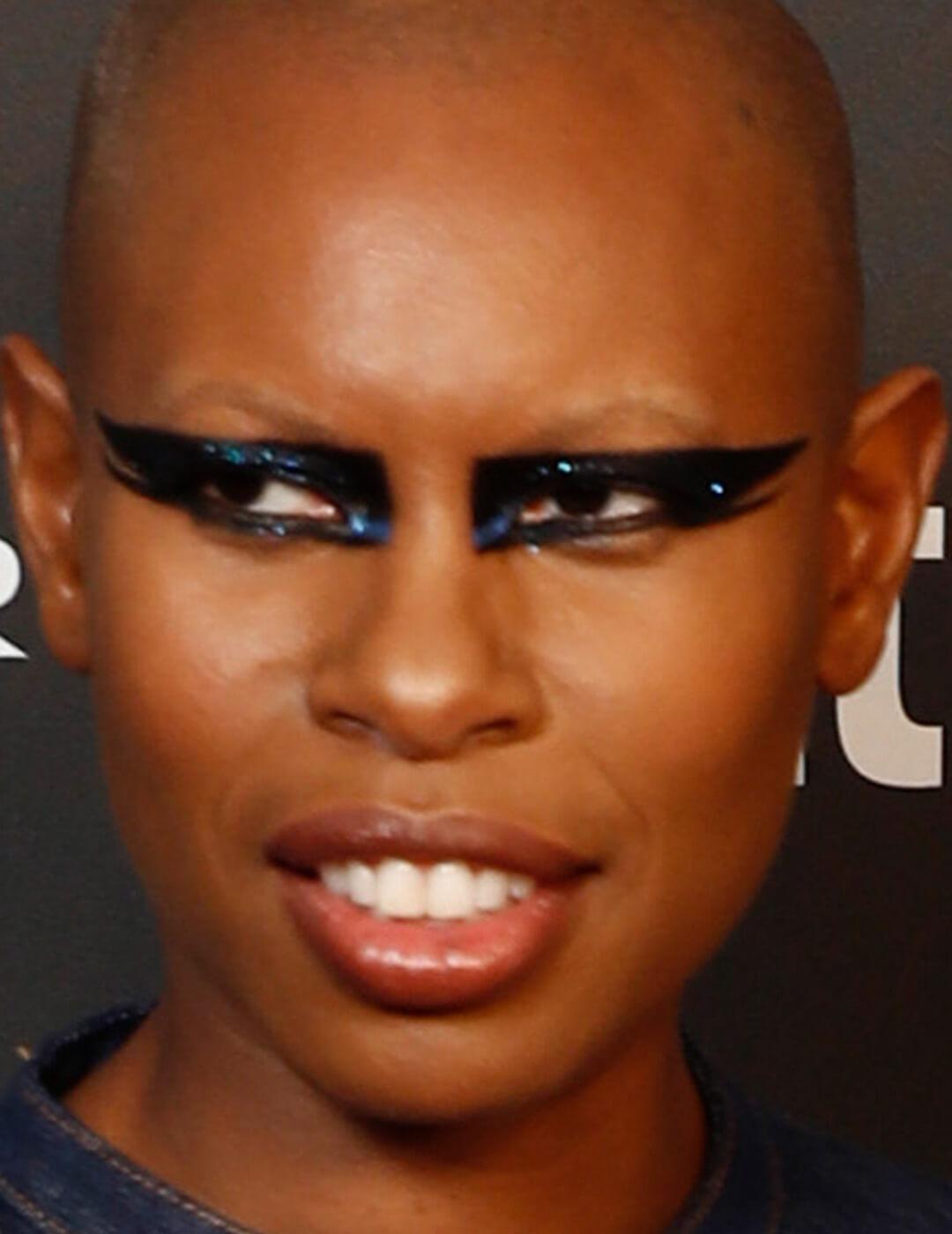 Skin rocking a graphic dark blue eye makeup look Mobile