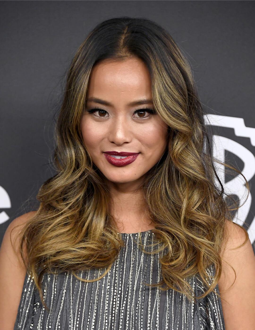 Jamie Chung wearing a silver dress rocking loose, big curls Desktop