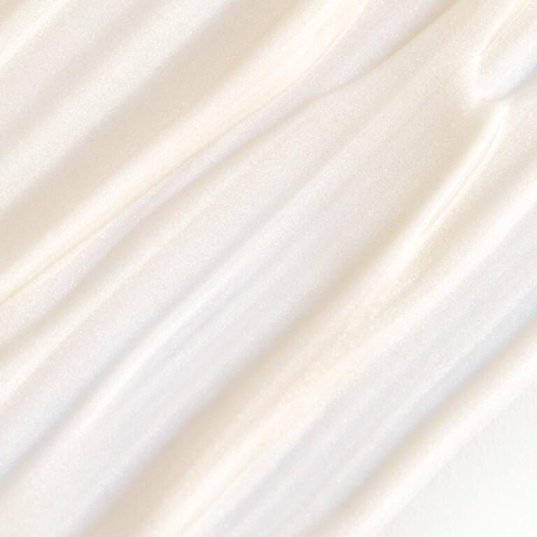 A close-up swatch of a pearl-colored illuminator. Desktop