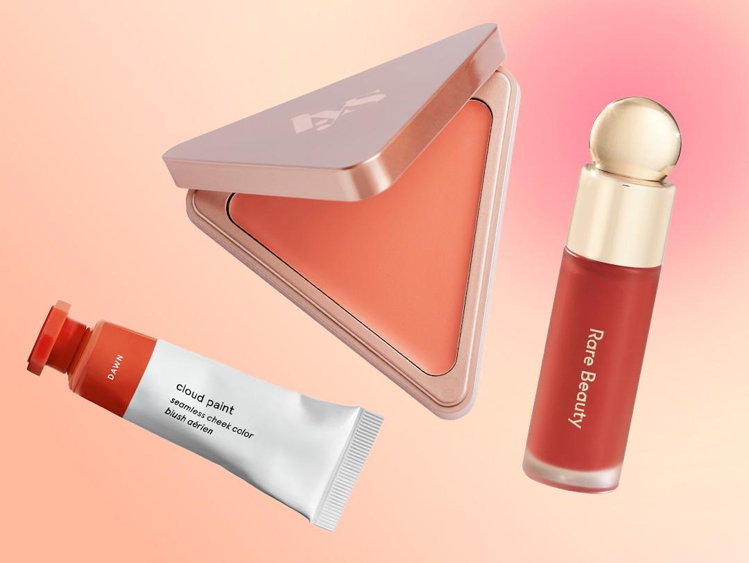 A flatlay of different blushes on a peach and pink gradient background Desktop