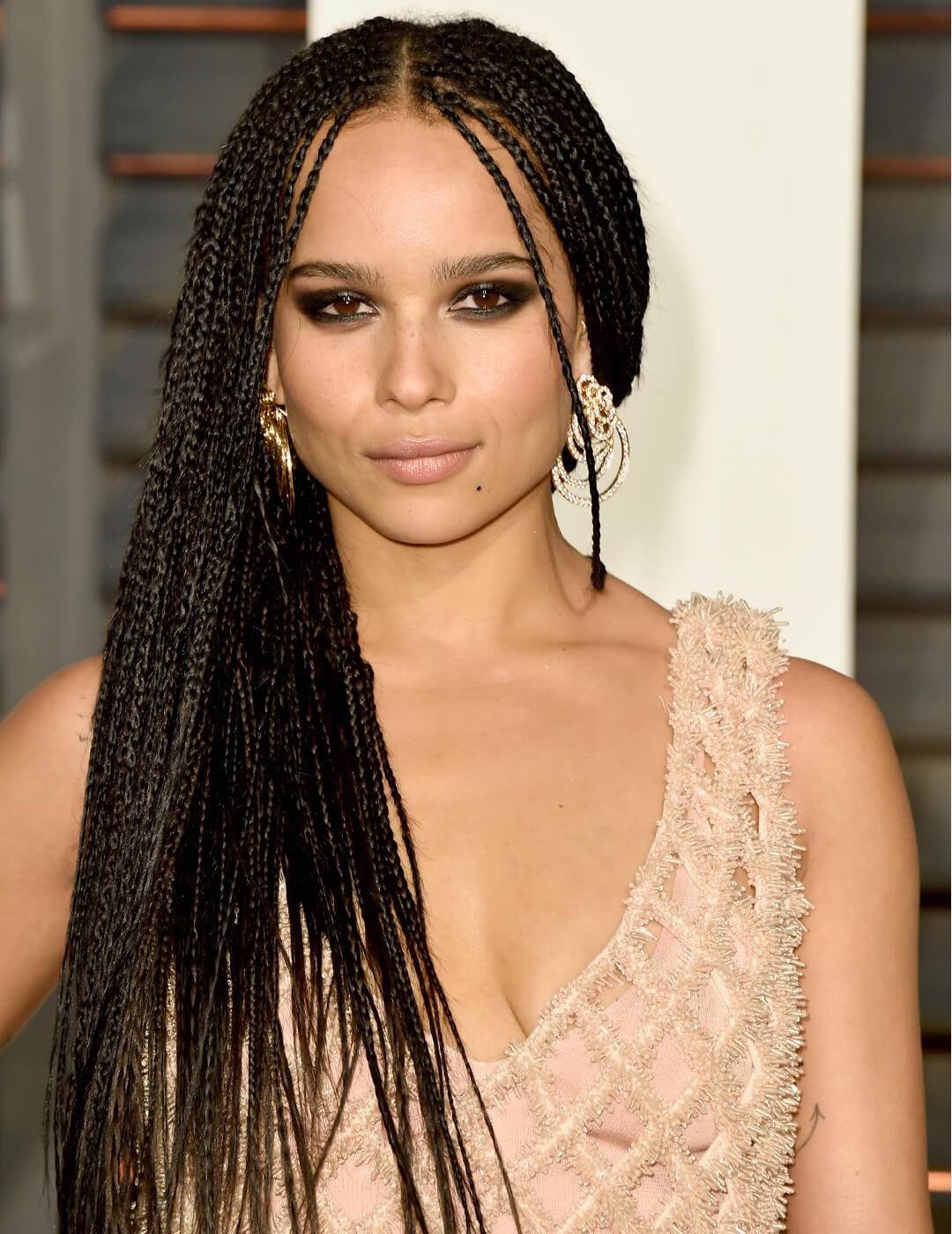Zoe Kravitz rocking a micro braided hairstyle in a nude pink feathery dress Mobile