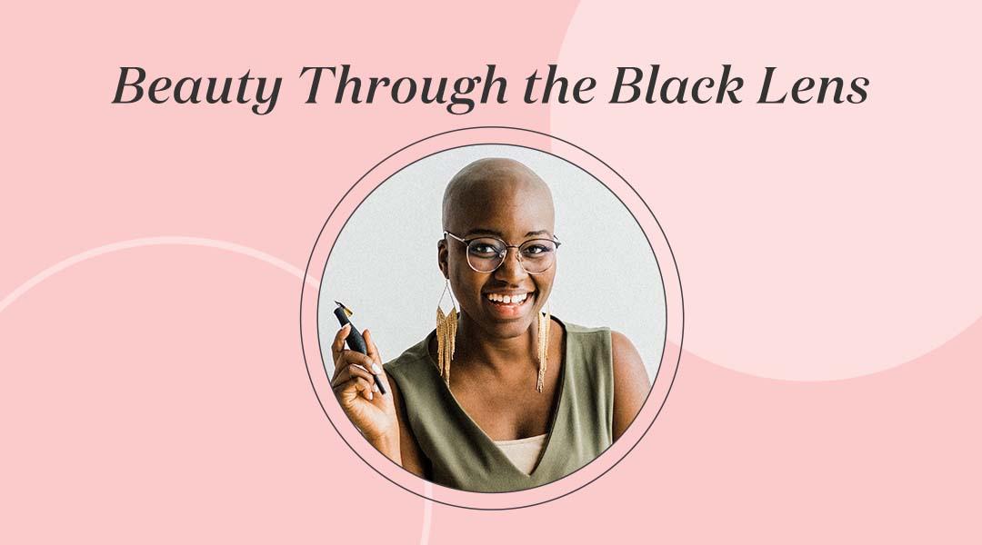 Portrait of Amanda Reid holding a calligraphy pen inside ink frame with black text Beauty Through the Black Lens Desktop