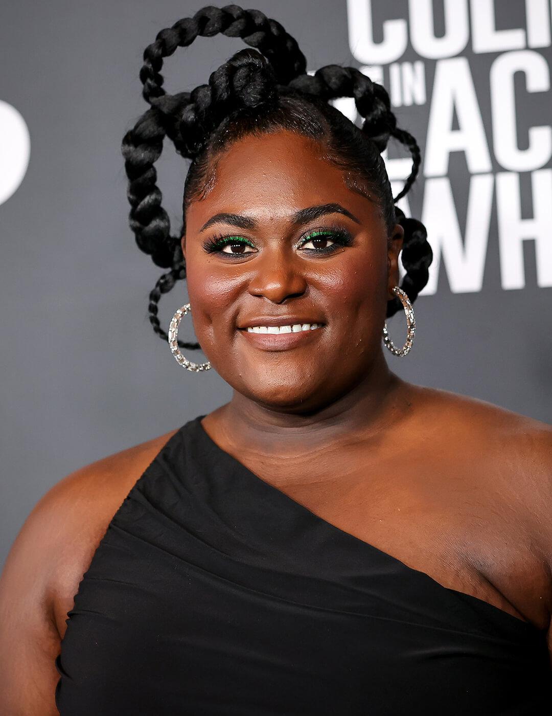 Danielle Brooks rocking a braided loops hairstyle and black dress on the red carpet Desktop