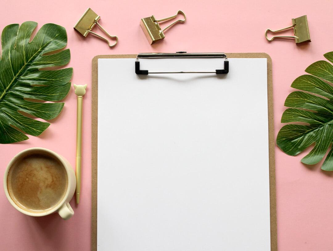 Above Shot Of Clipboard and Coffee Cup On Table Desktop