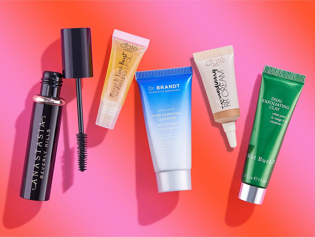 Beauty products from the October 2023 BoxyCharm by IPSY on gradient pink and red background Desktop