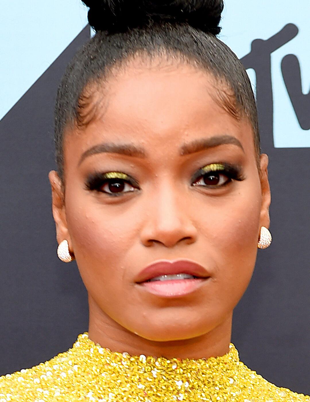 A photo of Keke Palmer with metallic yellow eyeshadow Desktop