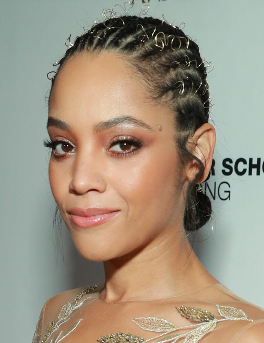 Bianca Lawson sporting a braided hairstyle with golden fine coiled wire Desktop