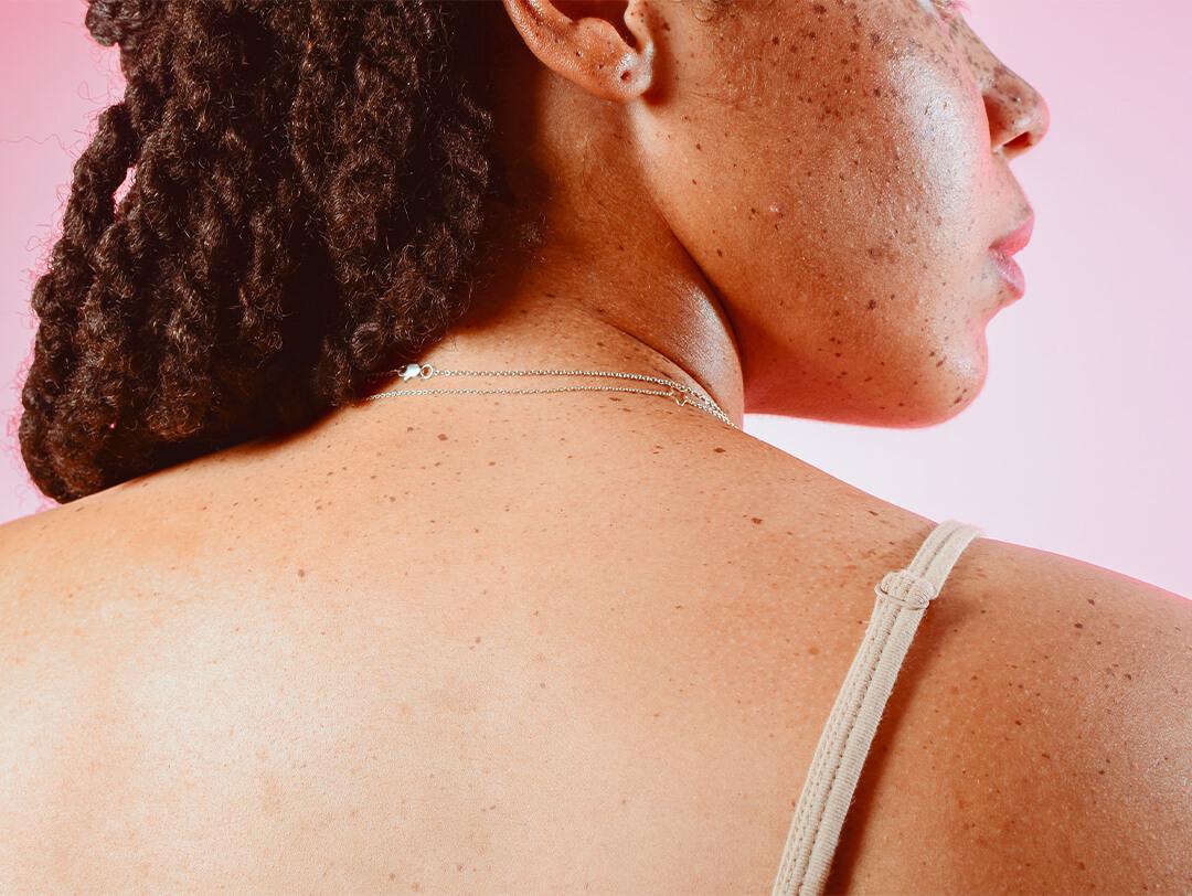 An image of a model looking over her shoulder. Desktop