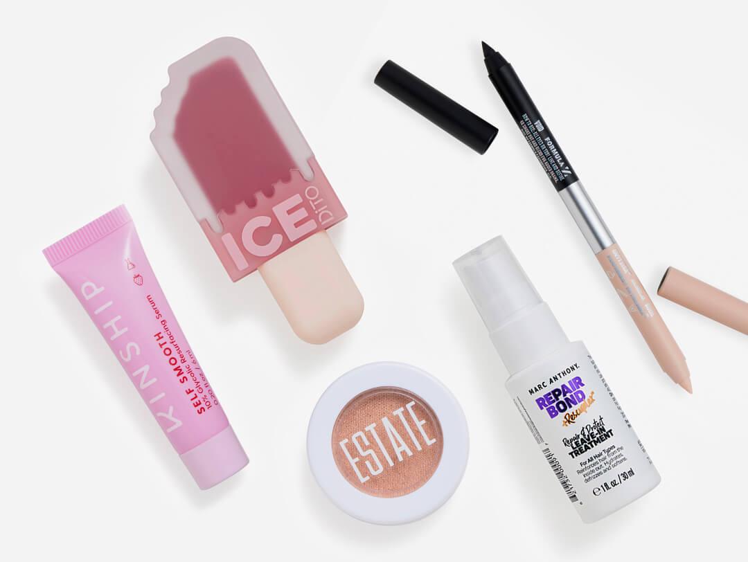 Hair care, makeup, and skincare products from the June 2023 IPSY Glam Bag Desktop