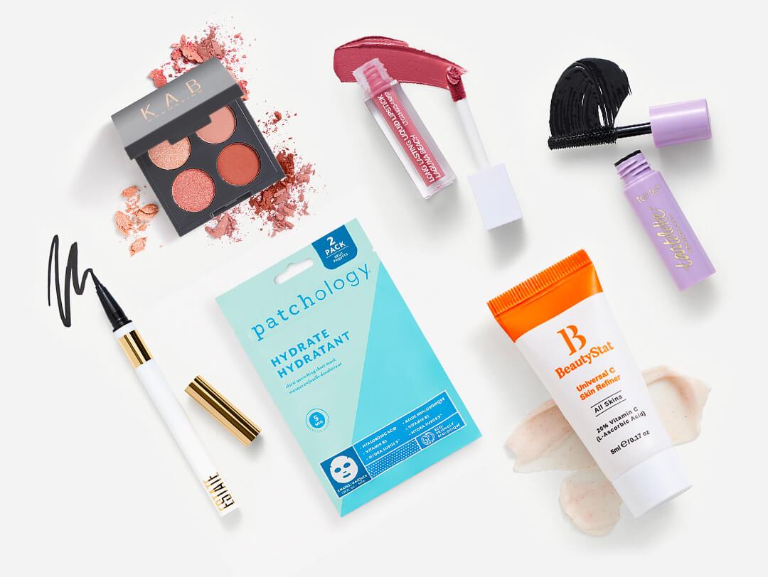 Makeup and skincare beauty products from the November 2023 IPSY Glam Bag on white background Desktop