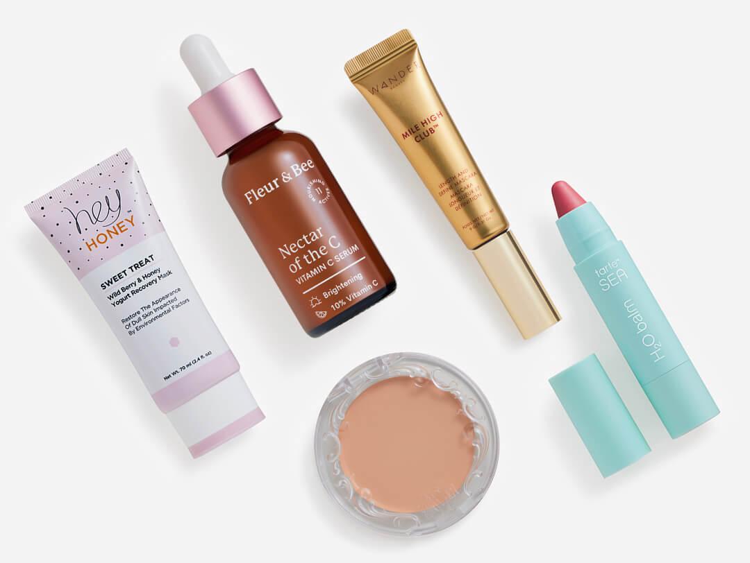 Makeup, skincare, and beauty products from the January 2023 IPSY Glam Bag Plus on white background Desktop