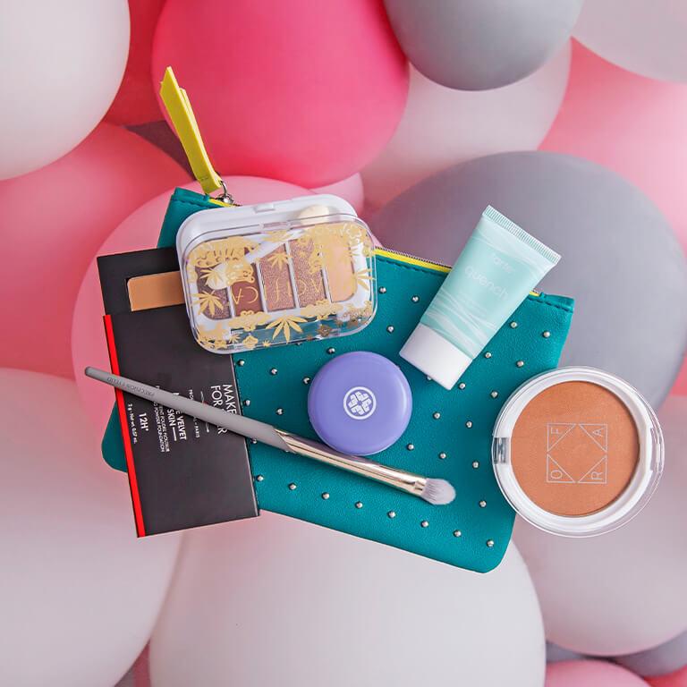 An image of the March Glam Bag, balloons, and some March products. Mobile