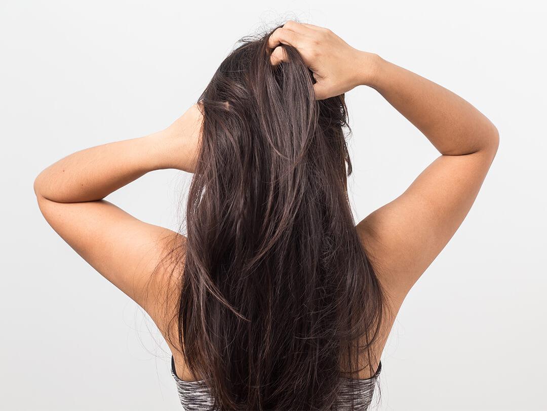 Woman running her hands through her hair Desktop