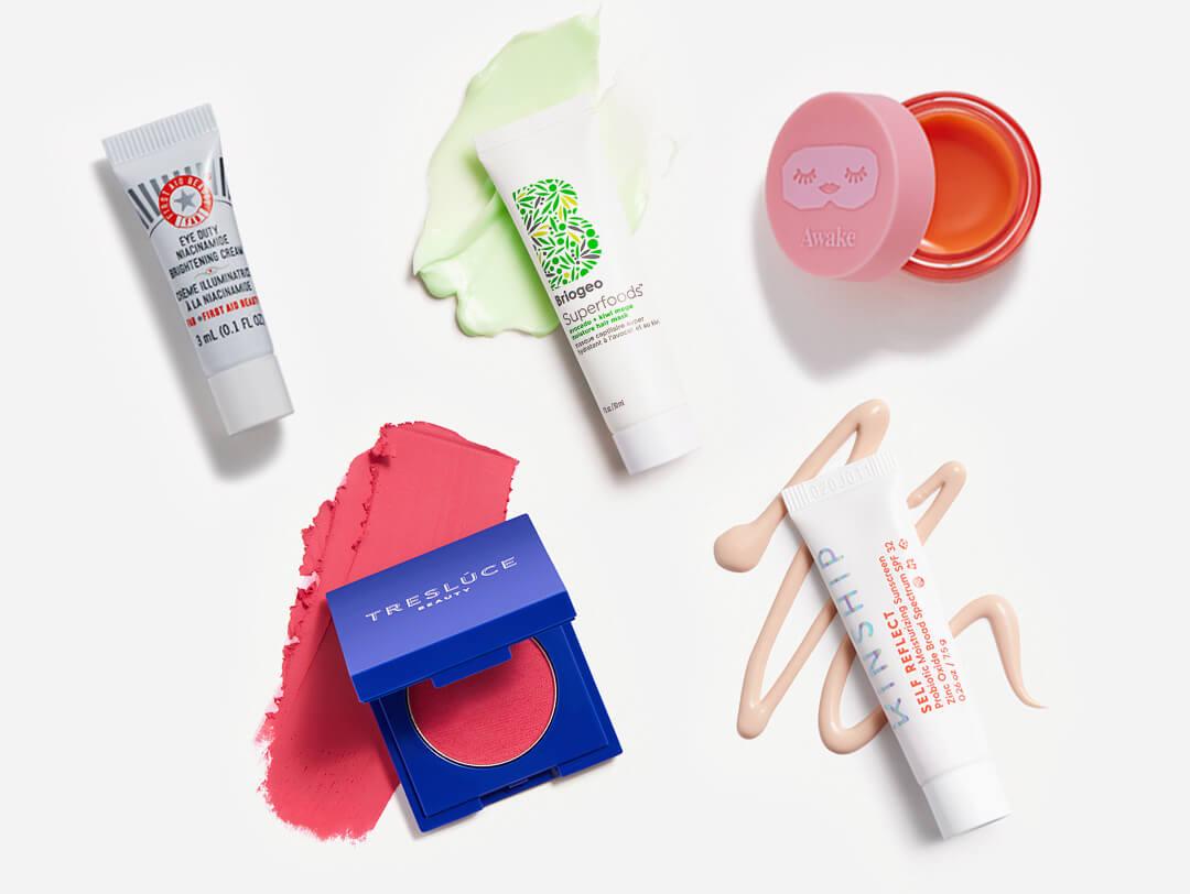 Makeup and skincare products from the May 2022 IPSY Glam Bag swatched on white background Desktop