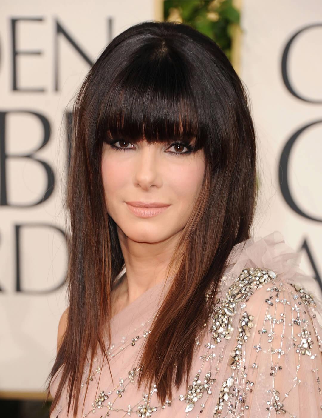Sandra Bullock rocking full bangs and sequined nude dress at the red carpet Mobile