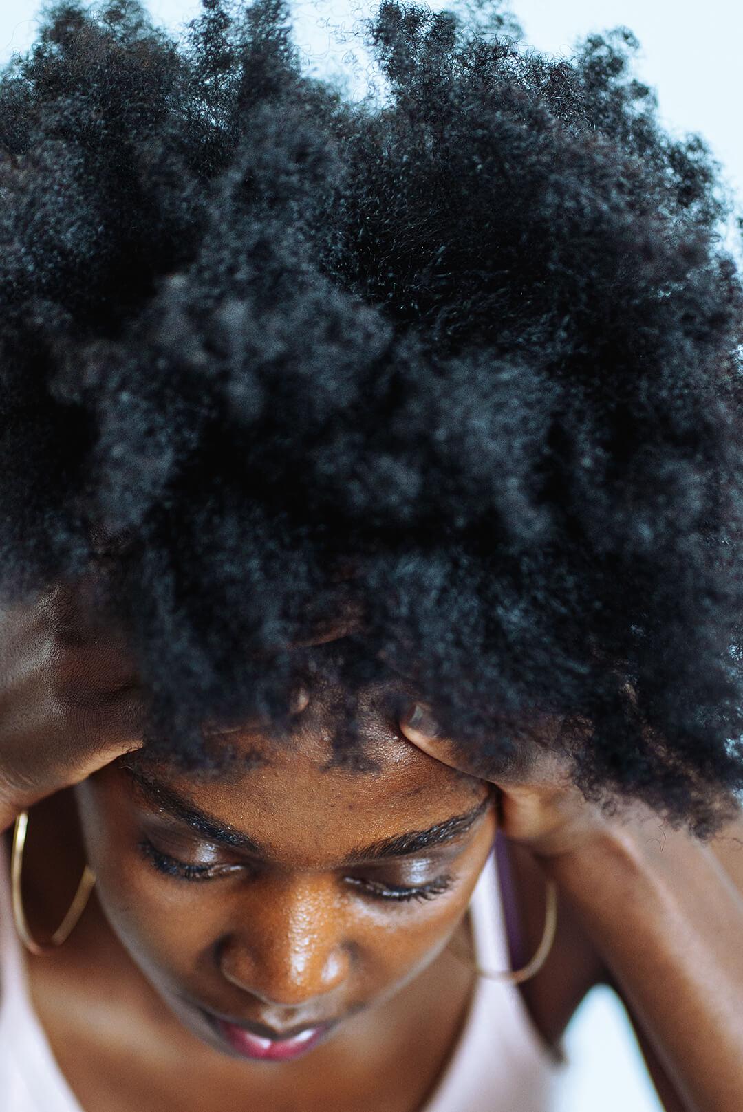 African-American woman pampering, caring of head skin and hair Desktop