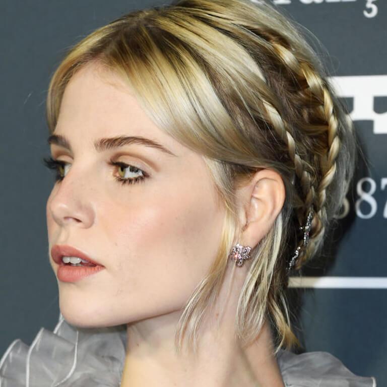 A closeup image of Lucy Boynton rocking a braided short hairstyle Desktop