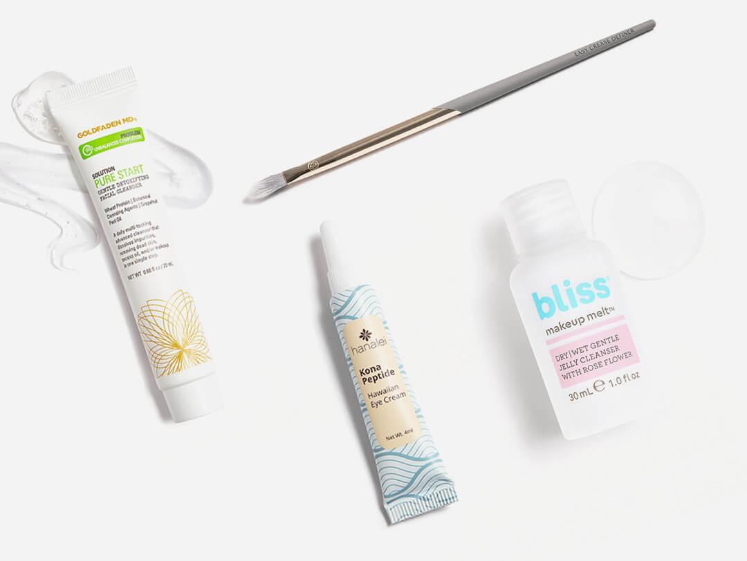 Skincare, hair care, and makeup products and tools swatched on white background Desktop