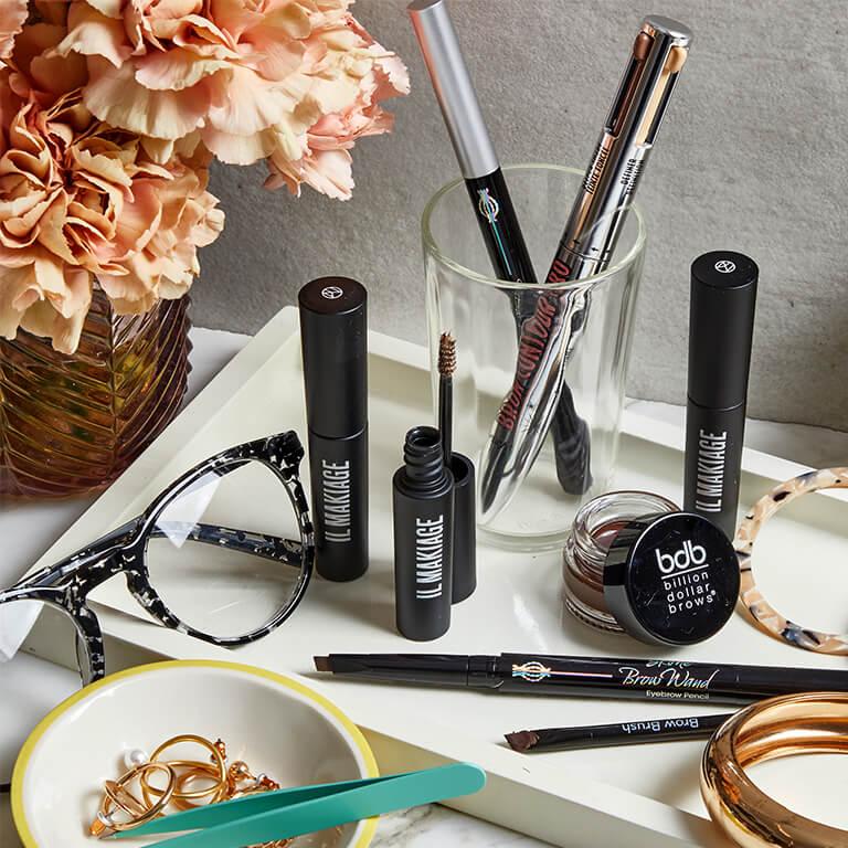 A flatlay image of eyebrow products from different brands Mobile